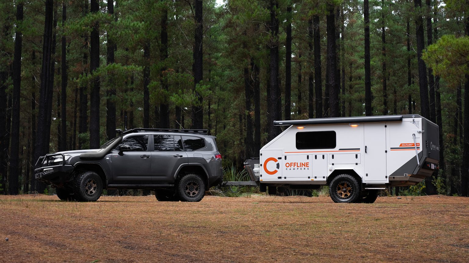 Offline Campers Solitaire 14 compact off-road hybrid behind a LandCruiser — image courtesy of Offline Campers